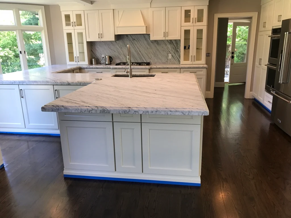 Luxury kitchen with island and hardwood