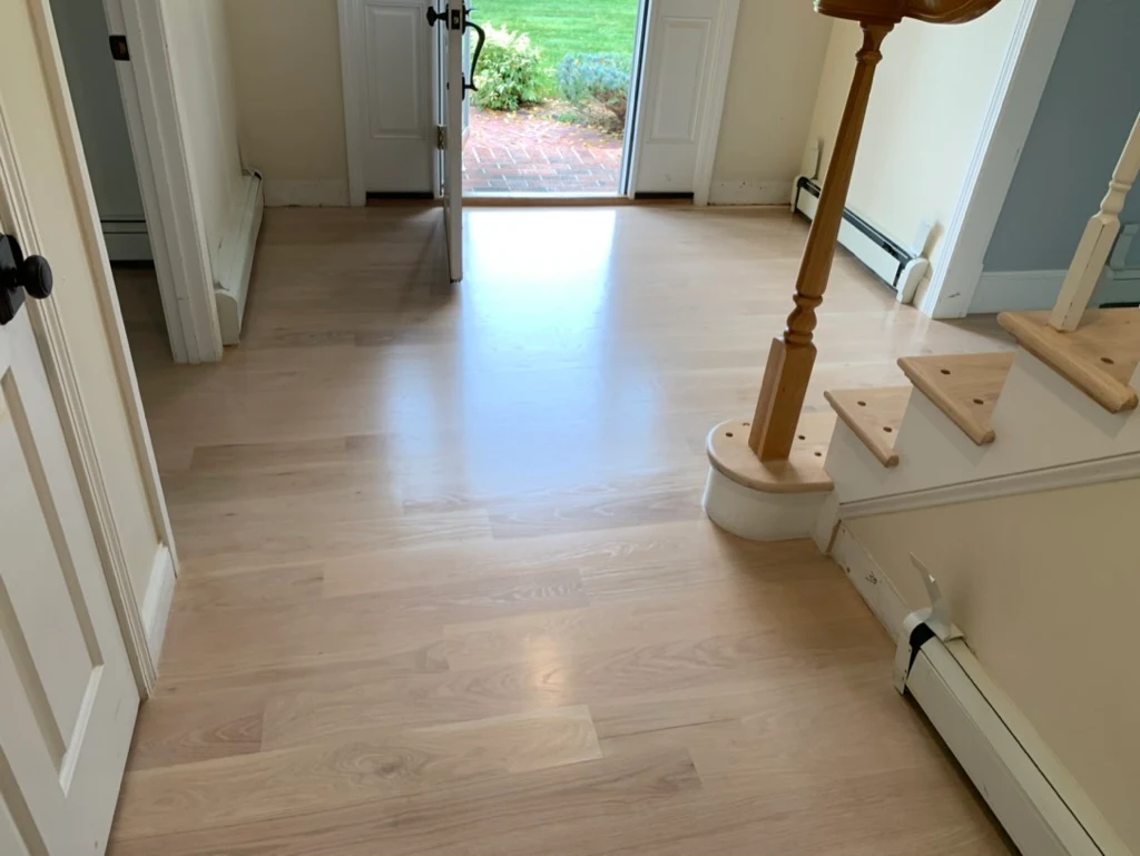 Light oak foyer with railing installation