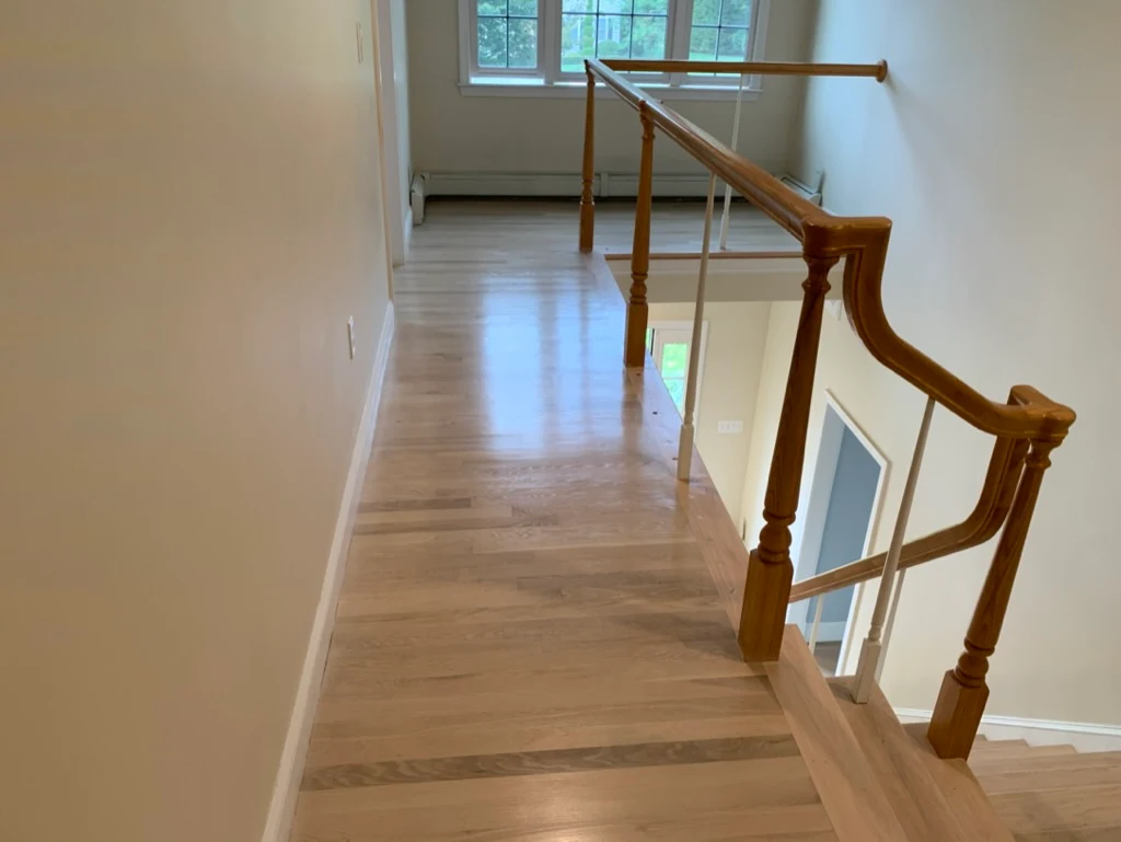 Hallway with natural oak and railing