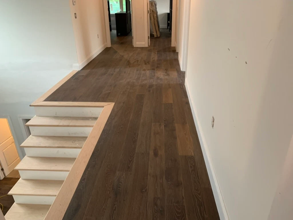 Hallway with dark stained floor