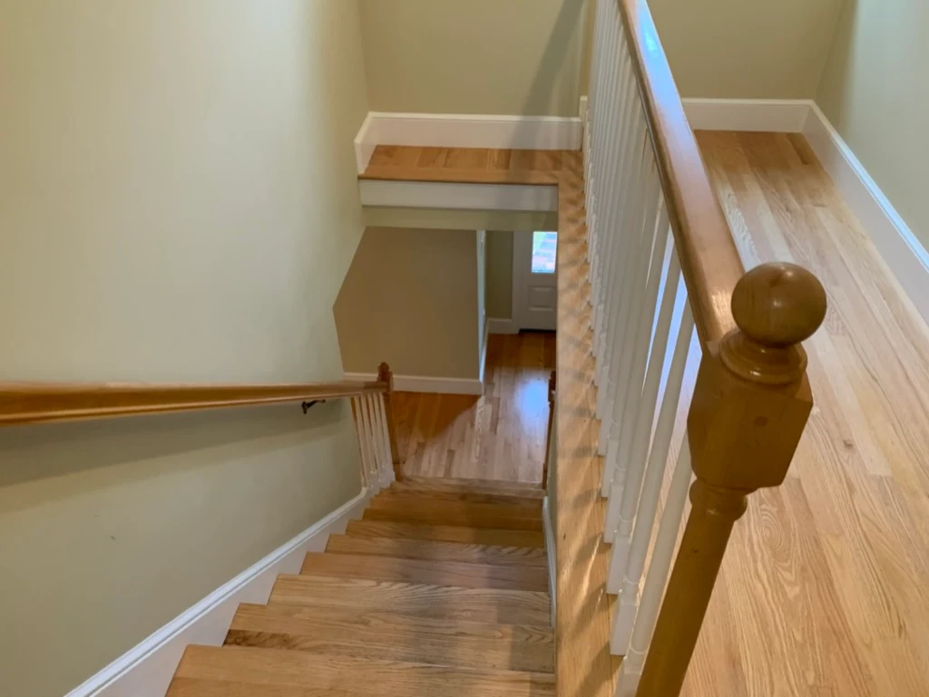 Stair landing with natural wood