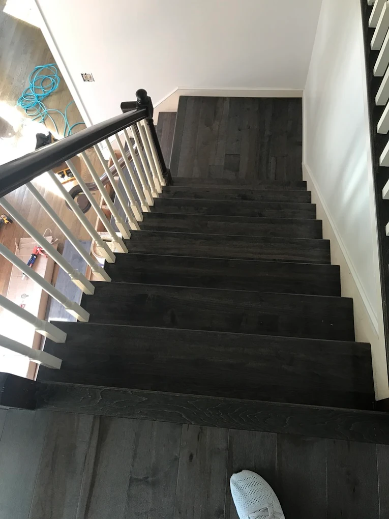 Dark staircase with landing