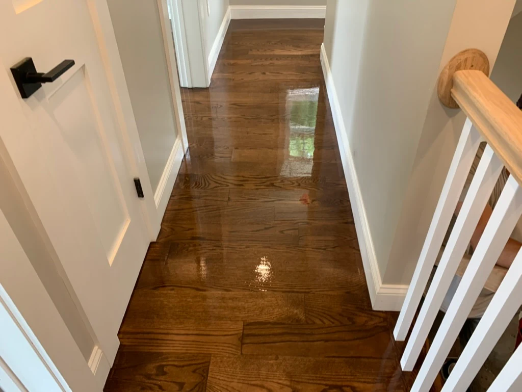 Espresso stained hallway with staircase access