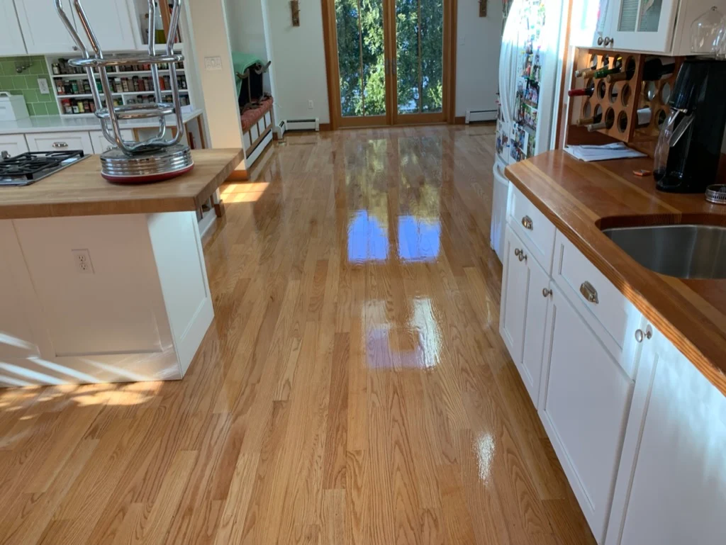 Contemporary kitchen with honey oak hardwood