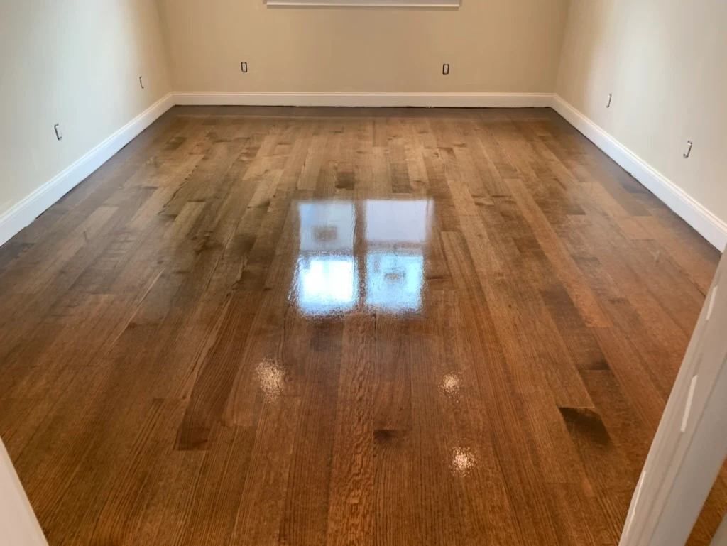 Natural oak hardwood in bright empty room