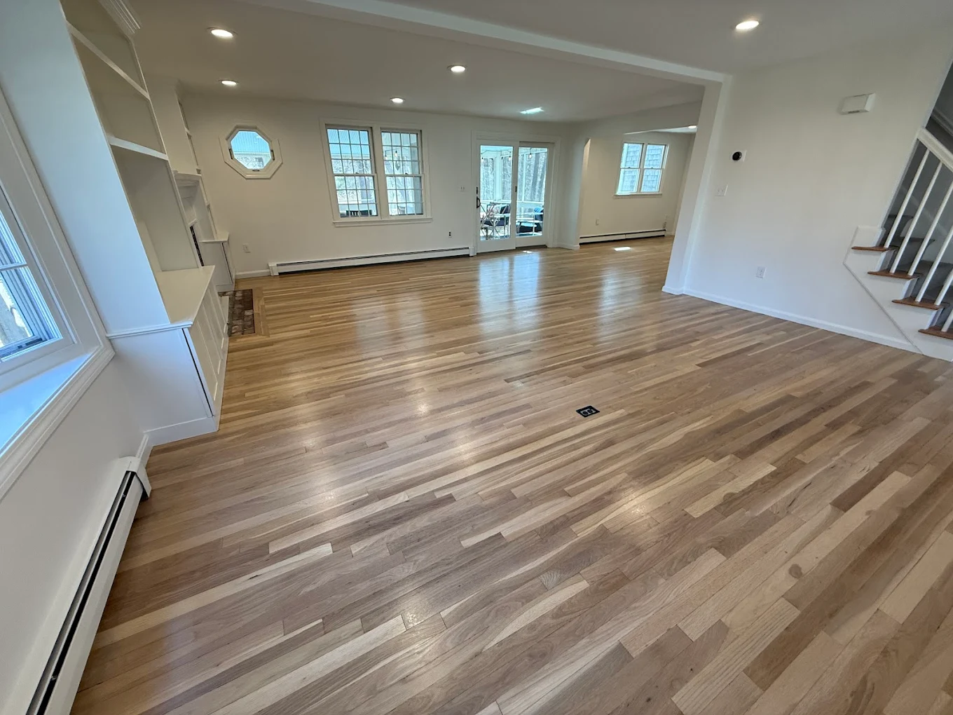 Open living room with natural oak hardwood