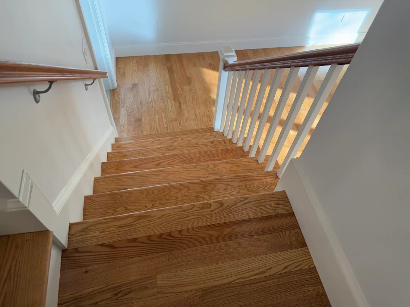 Natural oak staircase with wood railing