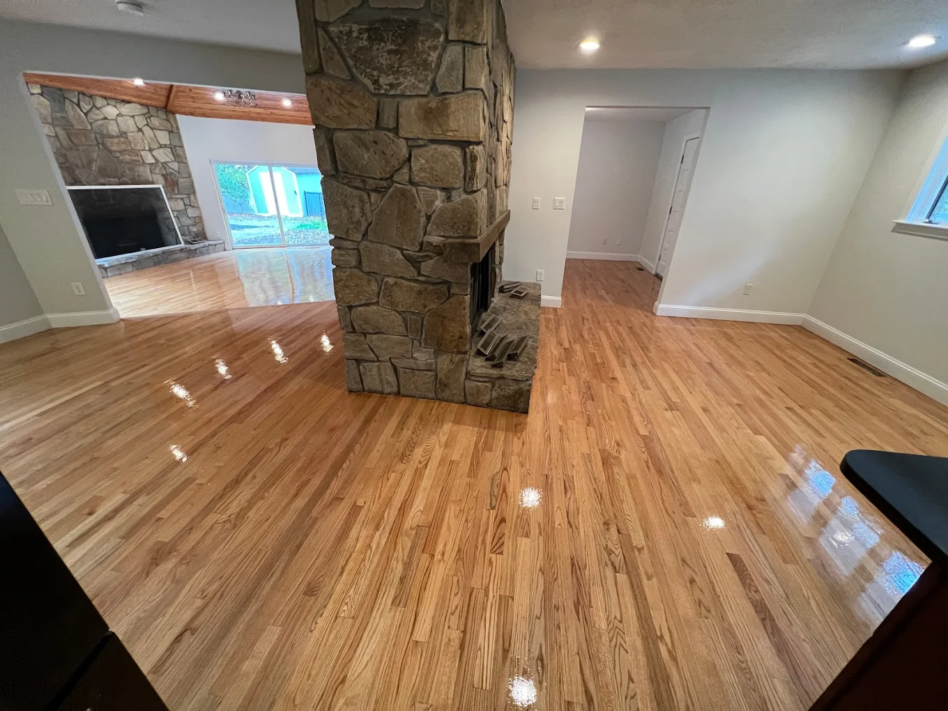 Natural oak floor with stone fireplace