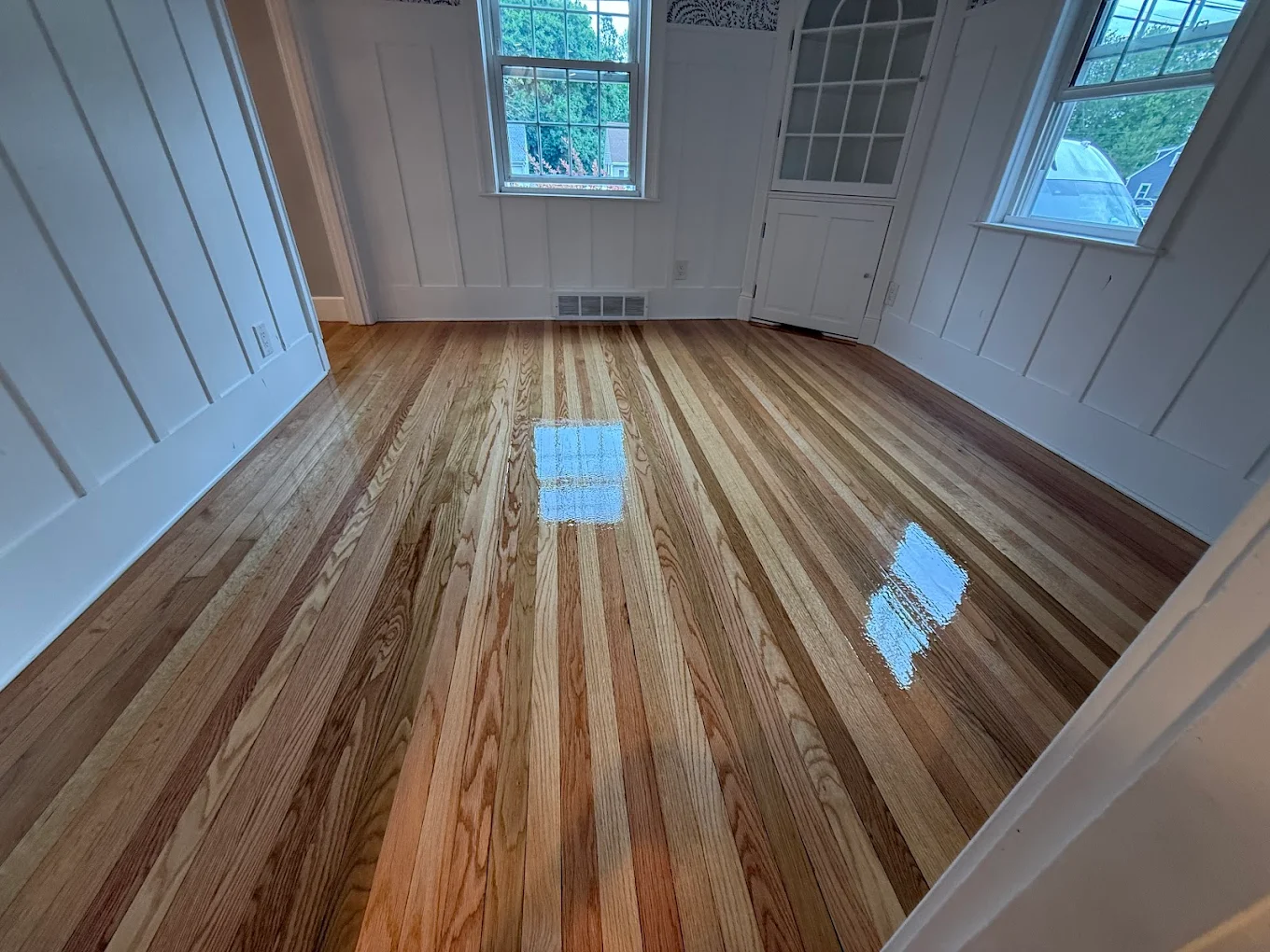 Refined light oak flooring in foyer